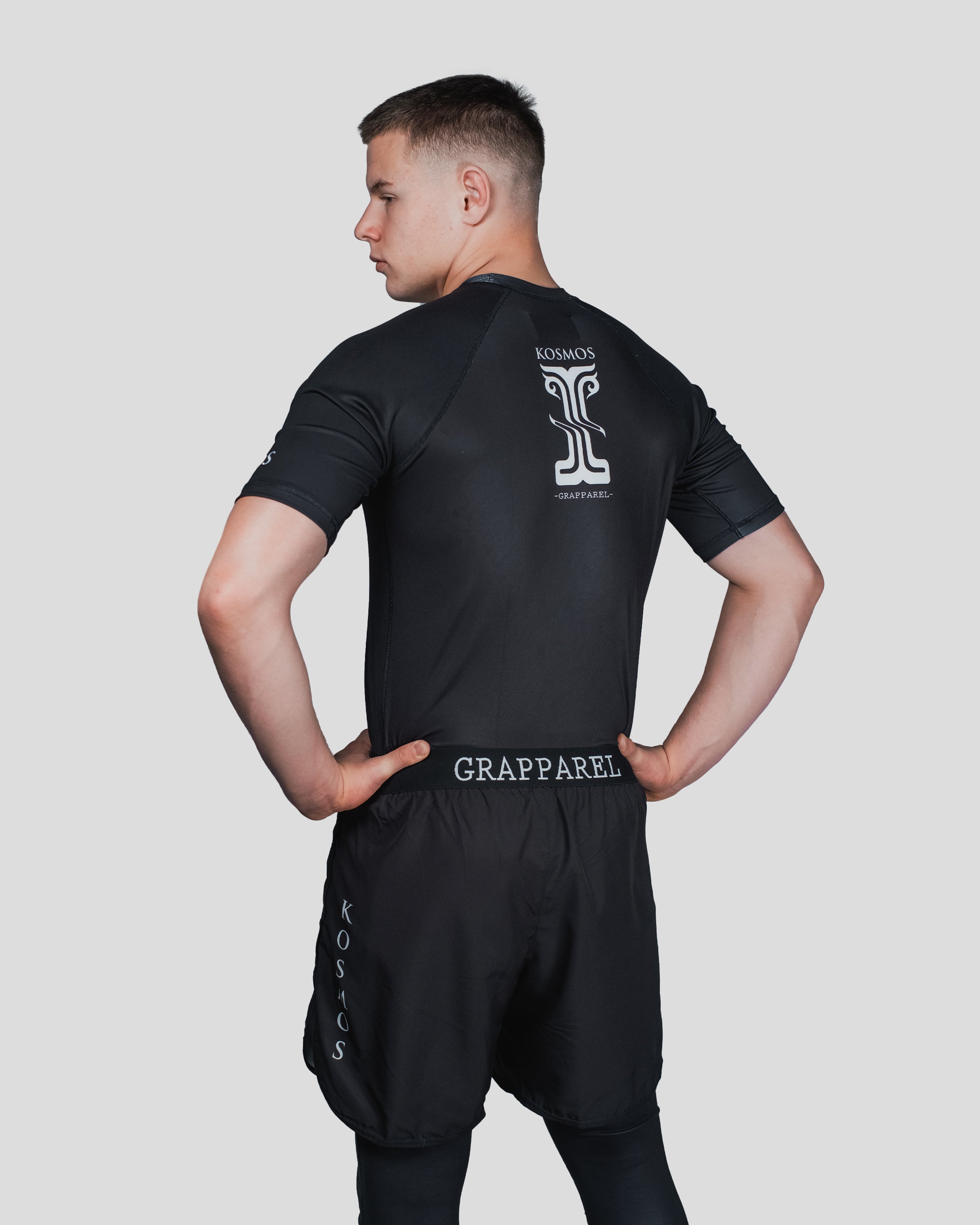 Back view of the Column Guard rash guard featuring the Kosmos logo